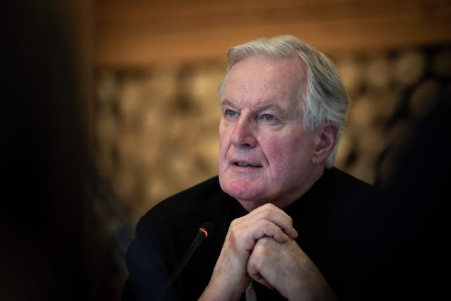 Michel Barnier, former French Prime Minister, speaks during the coordination committee meeting for the 2030 Winter Olympics in the French Alps in Val d'Isère, central eastern France, on December 1, 2025. (Photo by ARNAUD FINISTRE / AFP)