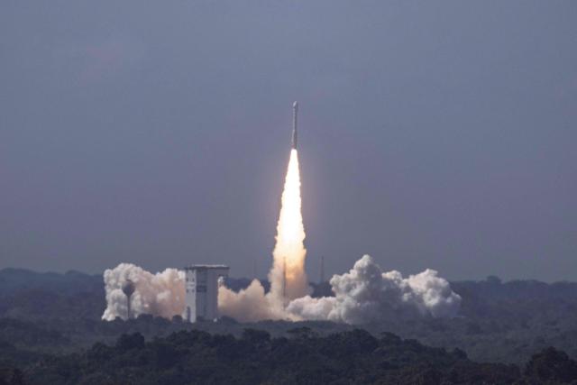 TOPSHOT - This photograph shows the European Space Agency (ESA) Vega-C rocket carrying the KOMPSAT-7 satellite (KOrea Multi-Purpose SATellite-7) produced by Korea Aerospace Research Institute (KARI) during its launch at the Guiana Space Centre in Kourou, on the French overseas department of Guiana, on December 1, 2025. (Photo by Ronan LIETAR / AFP)