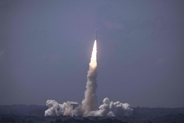 This photograph shows the European Space Agency (ESA) Vega-C rocket carrying the KOMPSAT-7 satellite (KOrea Multi-Purpose SATellite-7) produced by Korea Aerospace Research Institute (KARI) during its launch at the Guiana Space Centre in Kourou, on the French overseas department of Guiana, on December 1, 2025. (Photo by Ronan LIETAR / AFP)