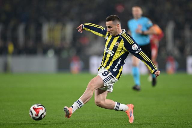 Fenerbahce's Turkish forwards #09 Kerem Akturkoglu kicks the ball during the Turkish Super lig football match between Fenerbahce and Galatasaray at the Fenerbahce Sukru Saracoglu stadium in Istanbul, on December 1, 2025. (Photo by Ozan KOSE / AFP)