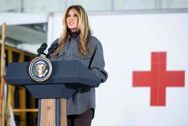 US First Lady Melania Trump speaks prior to making care packages for deployed members of the US military during an American Red Cross holiday event with military families at Joint Base Andrews in Maryland, December 1, 2025. (Photo by SAUL LOEB / AFP)