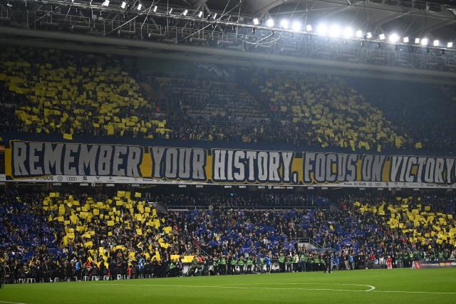 Fenerbahce's fans cheers for their team before the Turkish Super lig football match between Fenerbahce and Galatasaray at the Fenerbahce Sukru Saracoglu stadium in Istanbul, on December 1, 2025. (Photo by Ozan KOSE / AFP)