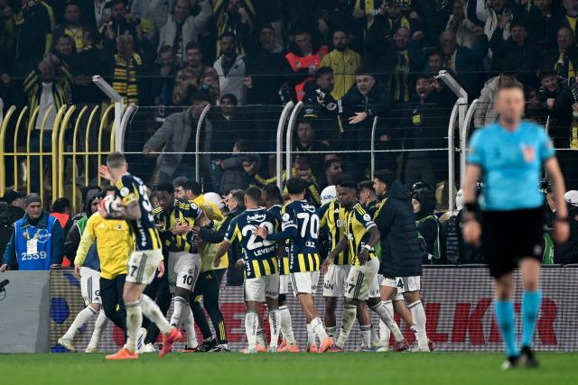 Fenerbahce's Colombian forward #10 Jhon Duran celebrates with teammates after scoring a goal during the Turkish Super lig football match between Fenerbahce and Galatasaray at the Fenerbahce Sukru Saracoglu stadium in Istanbul, on December 1, 2025. (Photo by Ozan KOSE / AFP)