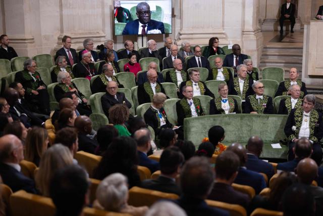 Members of the Academie des sciences morales et politiques (France's ethics and political sciences academy) attend the official entry ceremony of Congolese Nobel Peace Prize Laureate, human rights activist and gynaecologist, Denis Mukwege, as member of the Academie des Sciences Morales et Politiques (French Academy of ethics and political sciences), part of the Institut de France (France's prestigious Arts and Sciences Academy) at the Institut de France in Paris, on December 1, 2025. (Photo by Ian LANGSDON / AFP)