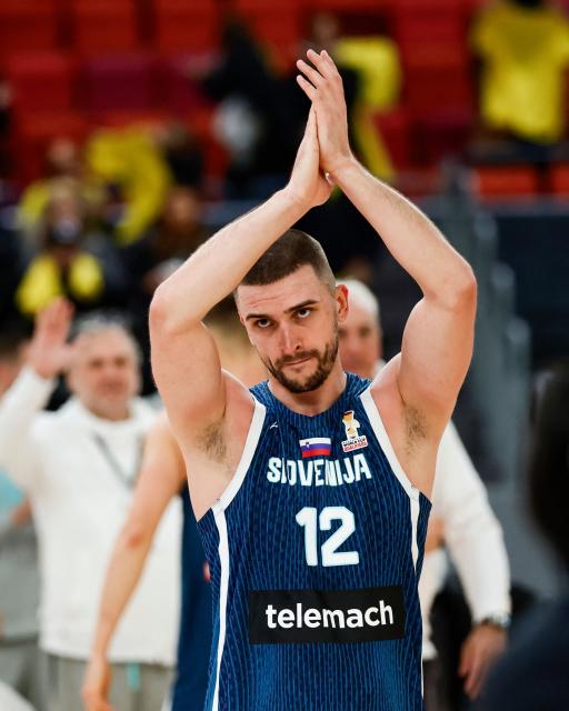 Slovenia's Rok Radovic celebrates after the team's 83-94 win of the 2027 FIBA Basketball World Cup qualifying match between Sweden and Slovenia at Scandinavium, Gothenburg, Sweden on December 1, 2025. (Photo by Adam IHSE / TT News Agency / AFP) / Sweden OUT