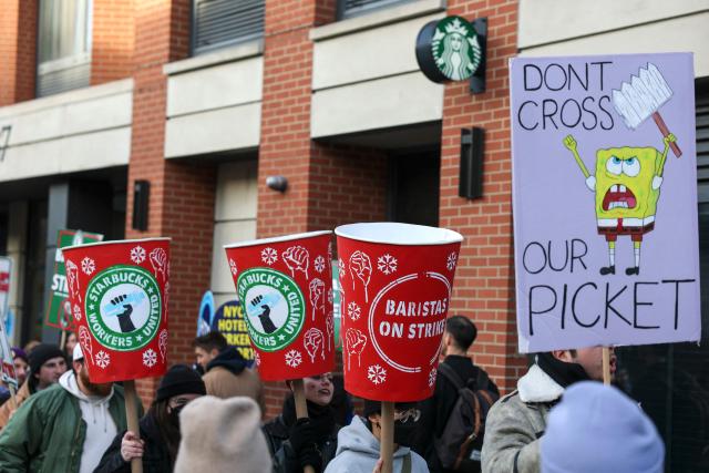 Striking Starbucks workers walk the picket line in New York on December 1, 2025. (Photo by ANGELA WEISS / AFP)