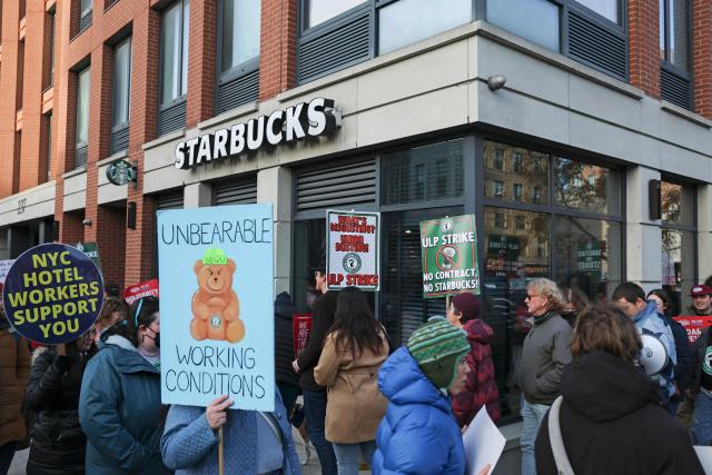 Striking Starbucks workers walk the picket line in New York on December 1, 2025. (Photo by ANGELA WEISS / AFP)
