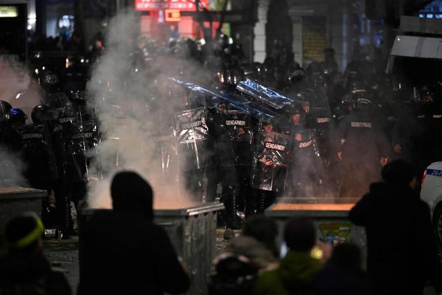 Bulgarian Gendarmerie officers clash with protesters during an anti-government protests in Sofia on December 1, 2025. Tens of thousands of people held anti-government protests in Bulgaria on Monday, widening an anti-corruption movement sweeping the European Union's poorest country as it prepares to adopt the euro. (Photo by Nikolay DOYCHINOV / AFP)