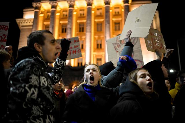 Protesters shout slogans during an anti-government protest in Sofia on December 1, 2025. Tens of thousands of people held anti-government protests in Bulgaria on Monday, widening an anti-corruption movement sweeping the European Union's poorest country as it prepares to adopt the euro. (Photo by Nikolay DOYCHINOV / AFP)