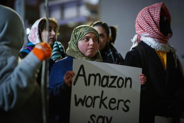 Demonstrators protest against Amazon on "Cyber Monday" outside Amazon Corporate Offices in New York City on December 1, 2025. (Photo by kena betancur / AFP)