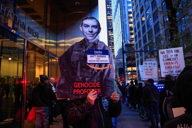 Demonstrators protest against Amazon on "Cyber Monday" outside Amazon Corporate Offices in New York City on December 1, 2025. (Photo by kena betancur / AFP)
