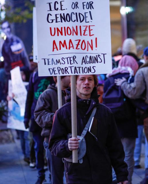 Demonstrators protest against Amazon on "Cyber Monday" outside Amazon Corporate Offices in New York City on December 1, 2025. (Photo by kena betancur / AFP)