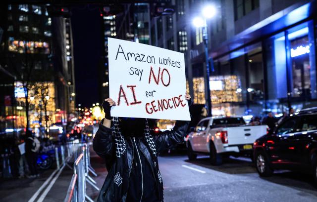 Demonstrators protest against Amazon on "Cyber Monday" outside Amazon Corporate Offices in New York City on December 1, 2025. (Photo by kena betancur / AFP)