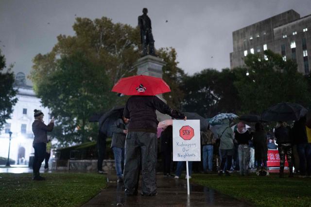 People protest against the ICE and Border Patrol operation outside of City Hall in New Orleans, Louisiana, on December 1, 2025. According to US media reports, US Immigration and Customs Enforcement (ICE) and US Customs and Border Patrol are expected to begin a large-scale immigration enforcement operation known as "Swamp Sweep" in Southern Louisiana and Mississippi. (Photo by Adam GRAY / AFP)