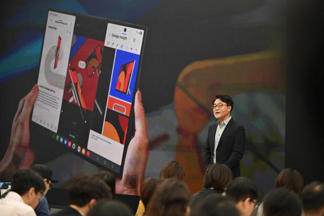 Kang Min-seok, head of the smartphone product planning team at Samsung Electronics, speaks during a launch event of Samsung Galaxy Z TriFold smartphone at a Samsung store in Seoul on December 2, 2025. Samsung Electronics unveiled its first tri-fold phone on December 2, as the conglomerate rushes to show it can keep pace with rivals in generative AI. (Photo by Jung Yeon-je / AFP)