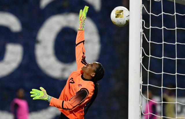 Bermuda's goalkeeper #12 Sharifa Crockwell concedes Guatemala's third goal during the Women Concacaf W qualifiers football match between Guatemala and Bermuda at Manuel Felipe Carrera stadium in Guatemala City on December 1, 2025. (Photo by JOHAN ORDONEZ / AFP)