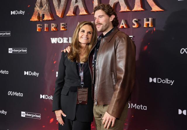 Journalist and former First Lady of California Maria Shriver and her son Christopher Schwarzenegger attend the premiere of Disney's "Avatar: Fire and Ash" at the Dolby theatre in Hollywood, California on December 1, 2025. (Photo by VALERIE MACON / AFP)