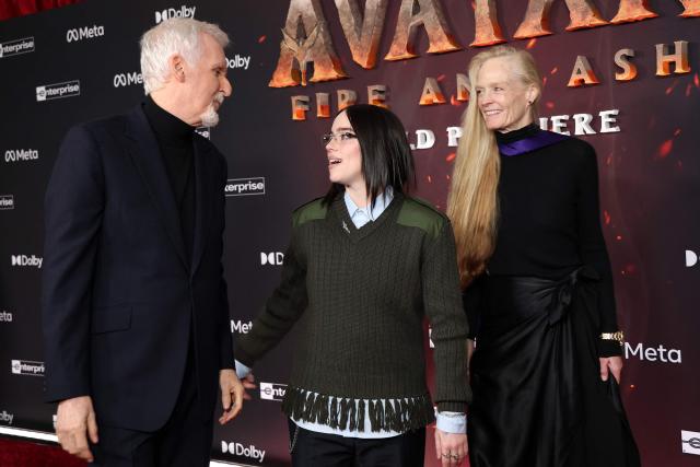 Canadian director James Cameron (L) and his wife US actress Suzy Amis Cameron (R) pose with US singer-songwriter Billie Eilish (C) as they attend the premiere of Disney's "Avatar: Fire and Ash" at the Dolby theatre in Hollywood, California on December 1, 2025. (Photo by VALERIE MACON / AFP)