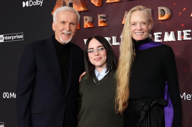 Canadian director James Cameron (L) and his wife US actress Suzy Amis Cameron (R) pose with US singer-songwriter Billie Eilish (C) as they attend the premiere of Disney's "Avatar: Fire and Ash" at the Dolby theatre in Hollywood, California on December 1, 2025. (Photo by VALERIE MACON / AFP)