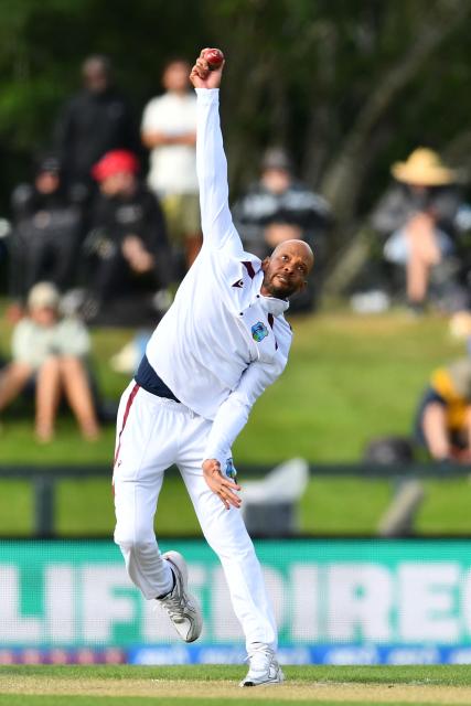 West Indies' Roston Chase bowls during day one of the first Test cricket match between New Zealand and West Indies at Hagley Oval in Christchurch on December 2, 2025. (Photo by Sanka Vidanagama / AFP)