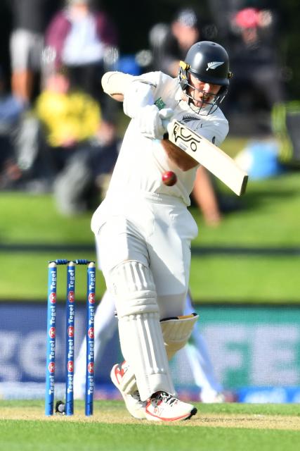 New Zealand's Michael Bracewell plays a shot during day one of the first Test cricket match between New Zealand and West Indies at Hagley Oval in Christchurch on December 2, 2025. (Photo by Sanka Vidanagama / AFP)