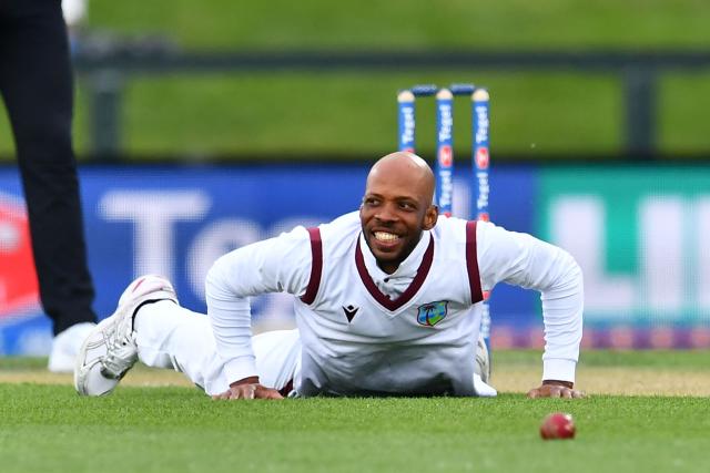 West Indies' Roston Chase reacts after one of his teammate dropped a catch during day one of the first Test cricket match between New Zealand and West Indies at Hagley Oval in Christchurch on December 2, 2025. (Photo by Sanka Vidanagama / AFP)