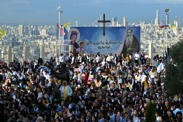 People gather before the visit of Pope Leo XIV to the Sisters of the Cross Hospital in Beirut's northern suburb of Jdeideh, on December 2, 2025.  (Photo by Andreas SOLARO / AFP)