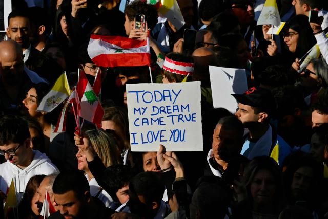 People gather before the visit of Pope Leo XIV to the Sisters of the Cross Hospital in Beirut's northern suburb of Jdeideh, on December 2, 2025.  (Photo by Andreas SOLARO / AFP)