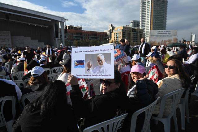 Faithfuls attend a mass led by Pope Leo XIV at Beirut's waterfront on December 2, 2025. Thousands of Lebanese faithful were making their way to Beirut's waterfront ahead of Pope Leo XIV's mass in the morning of December 2, the highlight of the Catholic leader's visit to the capital expected to draw huge crowds. (Photo by Jewel SAMAD / AFP)