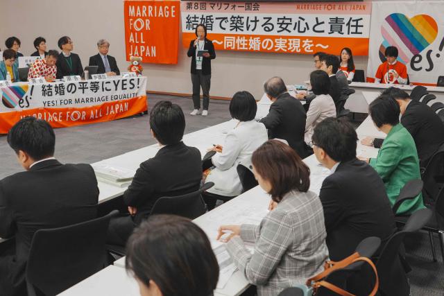 Japan's Diet members and supporters participate in a rally organised by Marriage For All Japan at the Diet Members' Office Building to accelerate discussions on legalising same-sex marriage, in Tokyo on December 2, 2025. (Photo by Kazuhiro NOGI / AFP)