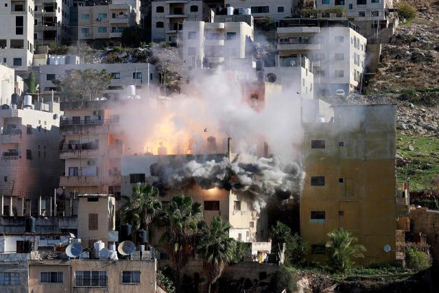 Smoke billows as Israeli forces demolish the house of Abdul Karim Snobar, who was detained by Israel earlier this year after being accused of plotting bus bombings, in the occupied West Bank city of Nablus on December 2, 2025. (Photo by Jaafar ASHTIYEH / AFP)