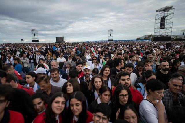 Faithful attend a mass led by Pope Leo XIV at the waterfront in Beirut on December 2, 2025. Around 150,000 people gathered at Beirut's waterfront for mass with Pope Leo XIV on December 2 morning, the highlight of the Catholic leader's visit to the capital, where he delivered a message of hope and peace. (Photo by Jewel SAMAD / AFP)