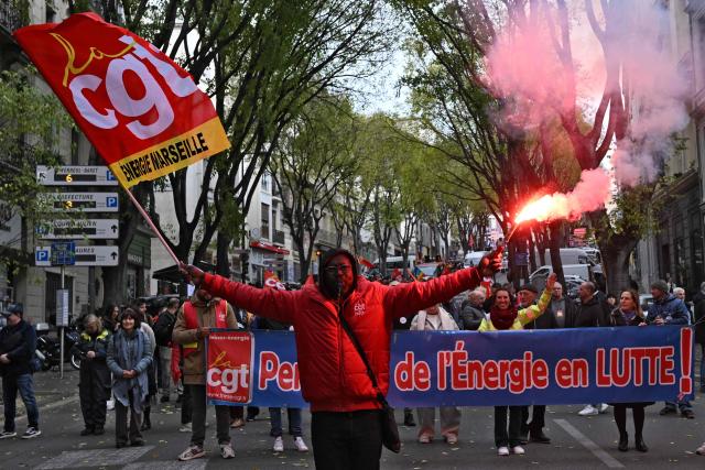 People participate in a demonstration as part of a call by trade unions for strikes and demonstrations for higher wages and against austerity, in Marseille, southern France, on December 2, 2025. (Photo by Miguel MEDINA / AFP)
