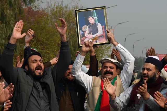Pakistan Tehreek-e-Insaf (PTI) party supporters protest to demand release of their jailed leader and Pakistan's former Prime Minister Imran Khan, in Peshawar on December 2, 2025. (Photo by Abdul MAJEED / AFP)