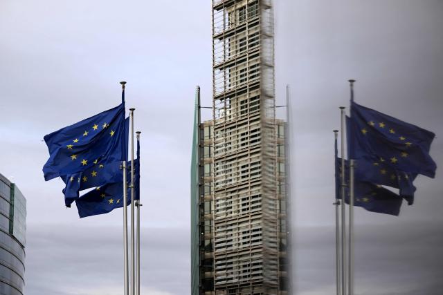 This photograph shows European flags fluttering in the European district in Brussels on December 2, 2025. (Photo by Nicolas TUCAT / AFP)