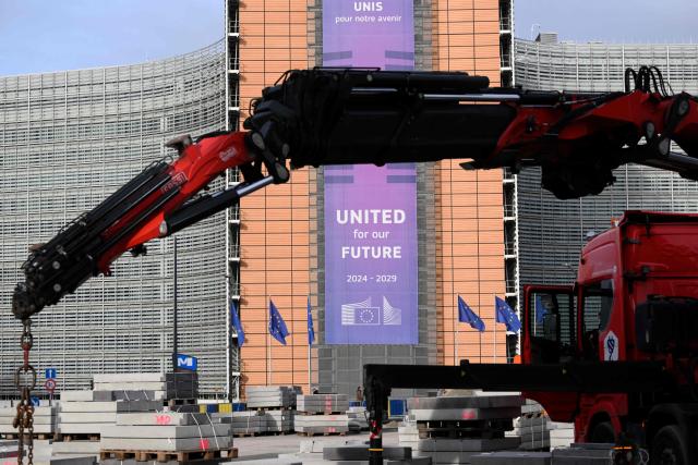 This photograph shows the Schuman roundabout construction site in front of the Berlaymont building, the EU Commission headquarters, in Brussels on December 2, 2025. (Photo by Nicolas TUCAT / AFP)