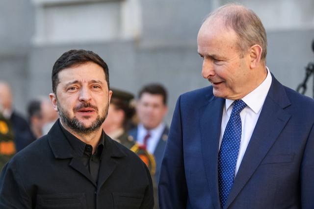 Ukraine's President Volodymyr Zelensky (L) meets with Ireland's Prime Minister Micheal Martin (R) during his visit to Dublin on December 2, 2025. (Photo by Paul Faith / AFP)