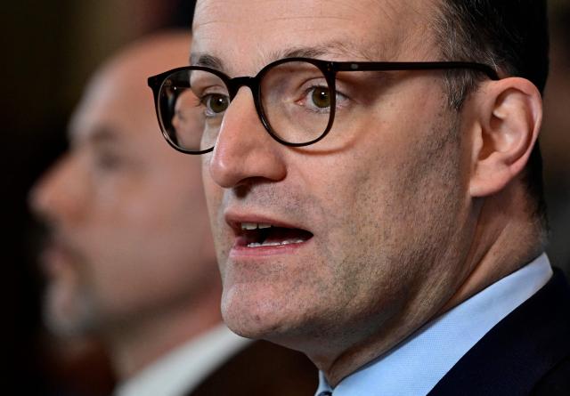 Jens Spahn (R), parliamentary group leader of the conservative Christian Democratic Union (CDU) party, and the CDU's sister party CSU's parliamentary group leader Alexander Hoffmann address journalists prior to a parliamentary group meeting of the conservative CDU/CSU party union on December 2, 2025 in Berlin, Germany. (Photo by John MACDOUGALL / AFP)