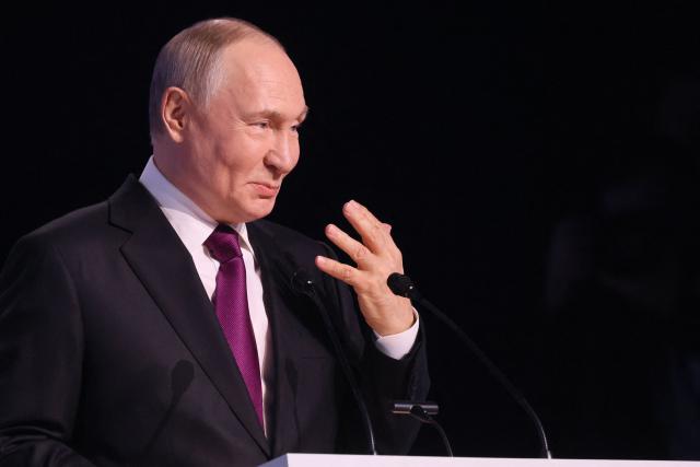 Russia's President Vladimir Putin gives a speech during a plenary session of the VTB Investment Forum "Russia Calling!" in Moscow on December 2, 2025. (Photo by SERGEI ILNITSKY / POOL / AFP)
