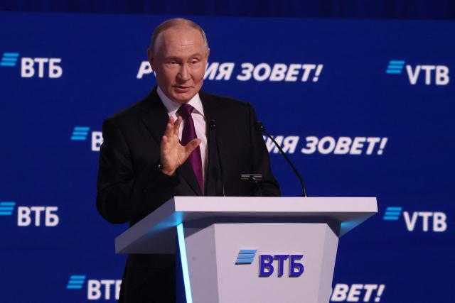 Russia's President Vladimir Putin gives a speech during a plenary session of the VTB Investment Forum "Russia Calling!" in Moscow on December 2, 2025. (Photo by SERGEI ILNITSKY / POOL / AFP)