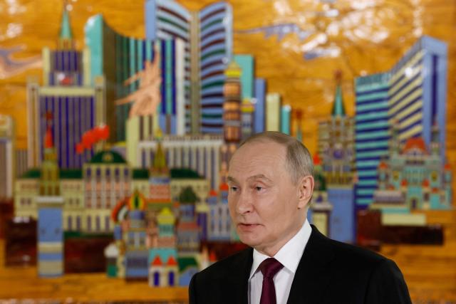 Russia's President Vladimir Putin meets with members of the media after addressing participants of the VTB Investment Forum "Russia Calling!" in Moscow on December 2, 2025. (Photo by SERGEI ILNITSKY / POOL / AFP)