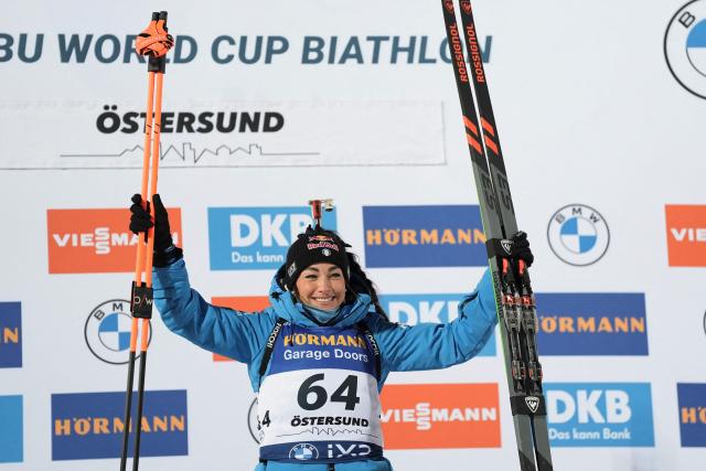 Italy's Dorothea Wierer celebrates on the podium after winning the women's 15km individual event of the IBU Biathlon World Cup in Oestersund, Sweden on December 2, 2025. (Photo by Bjorn LARSSON ROSVALL / TT NEWS AGENCY / AFP) / Sweden OUT