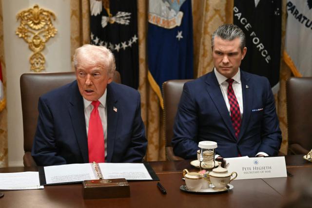 US President Donald Trump (L), alongside Secretary of Defense Pete Hegseth, holds a Cabinet Meeting in the Cabinet Room of the White House in Washington, DC on December 2, 2025. (Photo by ANDREW CABALLERO-REYNOLDS / AFP)
