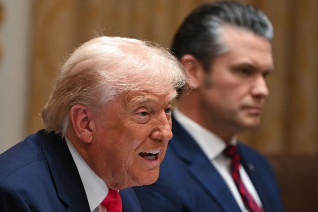 (L/R) US President Donald Trump speaks alongside Secretary of Defense Pete Hegseth during a Cabinet Meeting in the Cabinet Room of the White House in Washington, DC on December 2, 2025. (Photo by ANDREW CABALLERO-REYNOLDS / AFP)
