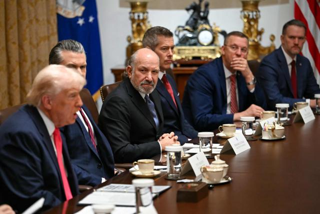 US President Donald Trump (L) speaks during a Cabinet Meeting in the Cabinet Room of the White House in Washington, DC on December 2, 2025. Also pictured, L/R, US Secretary of Defense Pete Hegseth, Secretary of Commerce Howard Lutnick, Secretary of Transportation Sean Duffy, Secretary for Veterans Affairs Doug Collins, and US Trade Representative Jamieson Greer. (Photo by ANDREW CABALLERO-REYNOLDS / AFP)