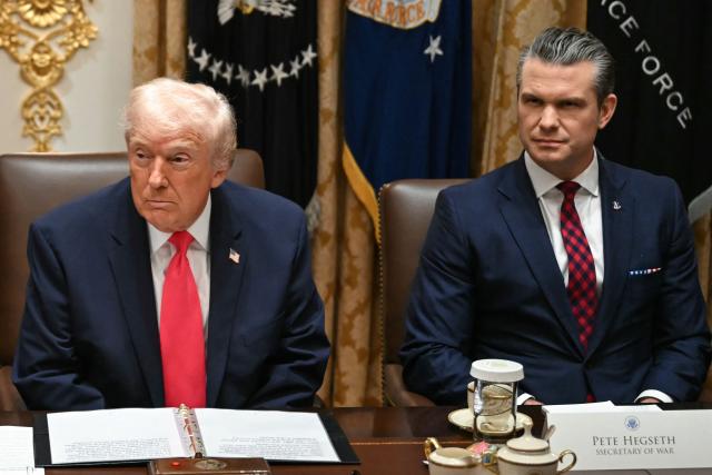 US President Donald Trump (L), alongside Secretary of Defense Pete Hegseth (R), holds a Cabinet Meeting in the Cabinet Room of the White House in Washington, DC on December 2, 2025. (Photo by ANDREW CABALLERO-REYNOLDS / AFP)
