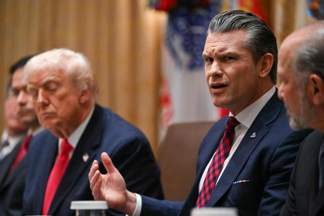US Secretary of Defense Pete Hegseth (R) speaks alongside President Donald Trump (L) during a Cabinet Meeting in the Cabinet Room of the White House in Washington, DC on December 2, 2025. (Photo by ANDREW CABALLERO-REYNOLDS / AFP)