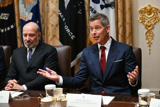 US Secretary of Transportation Sean Duffy (R) speaks alongside Secretary of Commerce Howard Lutnick (L) during a Cabinet Meeting held by President Donald Trump in the Cabinet Room of the White House in Washington, DC on December 2, 2025. (Photo by ANDREW CABALLERO-REYNOLDS / AFP)