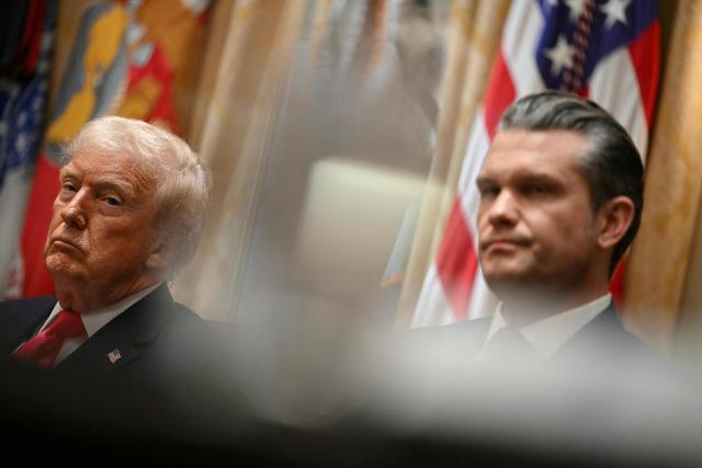 (L-R) President Donald Trump and US Secretary of Defense Pete Hegseth look on during a Cabinet Meeting in the Cabinet Room of the White House in Washington, DC on December 2, 2025. (Photo by ANDREW CABALLERO-REYNOLDS / AFP)