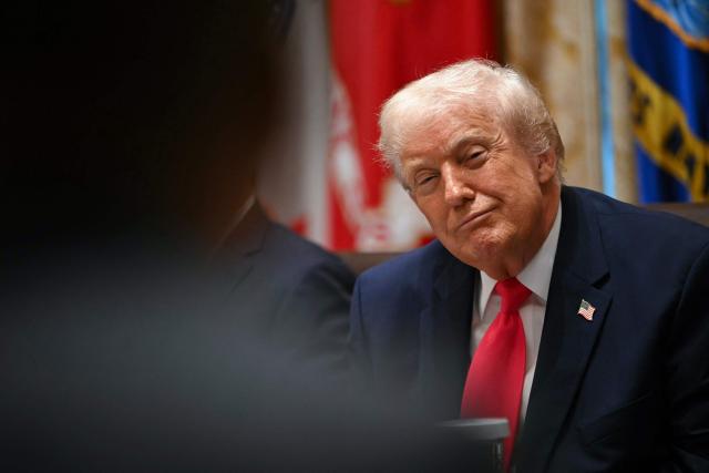 President Donald Trump looks on during a Cabinet Meeting in the Cabinet Room of the White House in Washington, DC on December 2, 2025. (Photo by ANDREW CABALLERO-REYNOLDS / AFP)